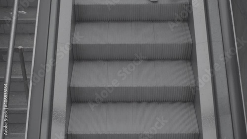 People going up on escalators. Overhead view