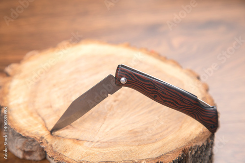 pocket knife on the wood