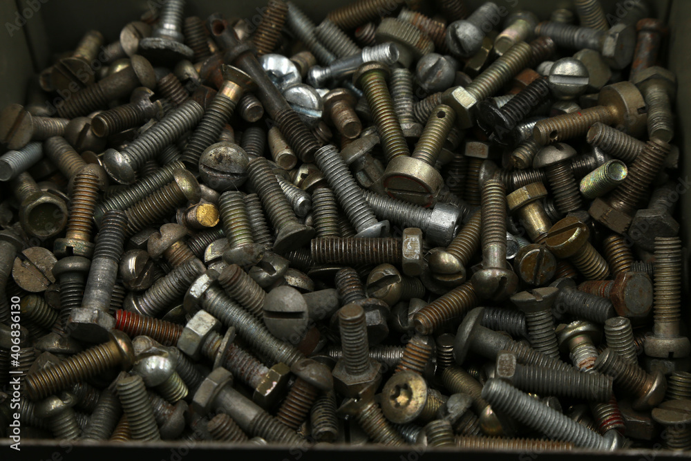 background of a pile of bolts in a box background of a pile of bolts in a box