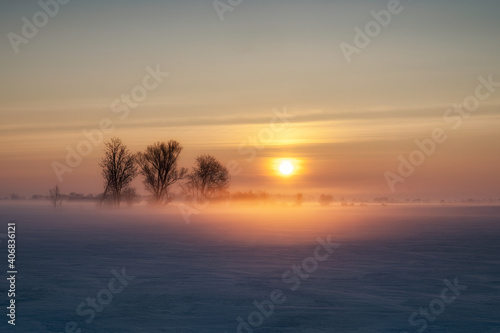 Frosty morning, arable fields in the morning fog and strong snow, Poland, Zulawy © janmiko