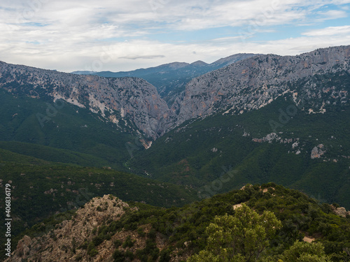 Aerial View of green forest landscape of Supramonte Mountains with famous hiking destinantion Gola Su Gorropu gorge, limestone rock and mediterranean vegetation, Nuoro, Sardinia, Italy. © Kristyna