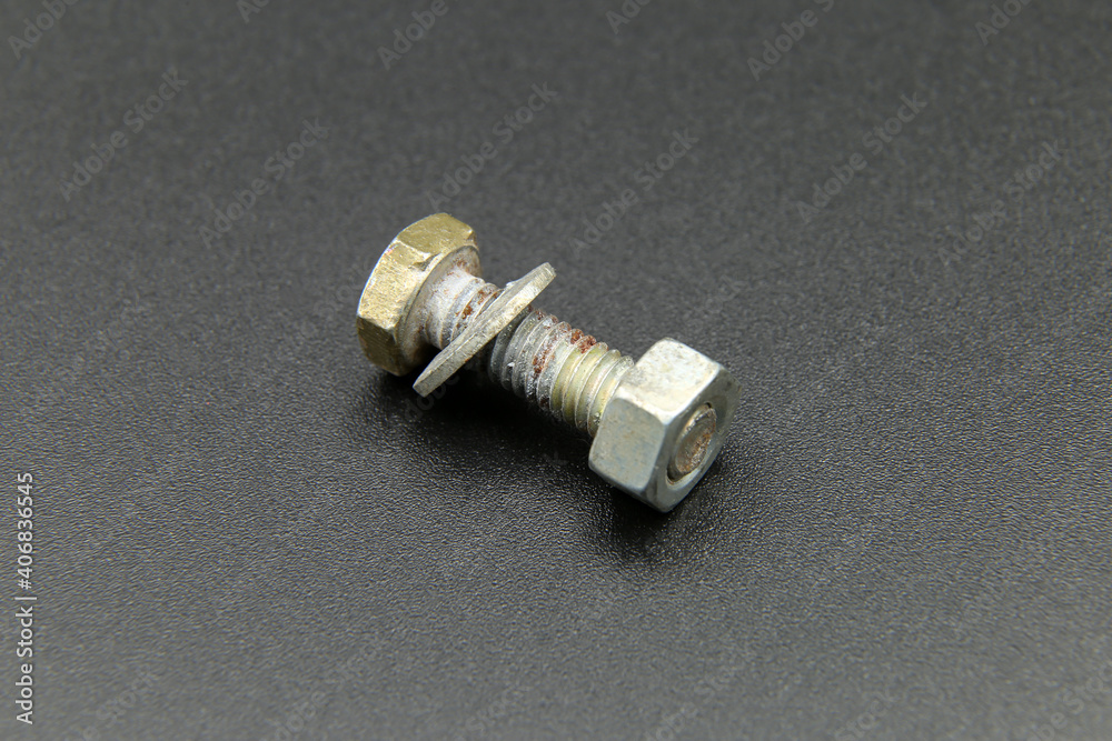 metal bolt on black background metal bolt on black background