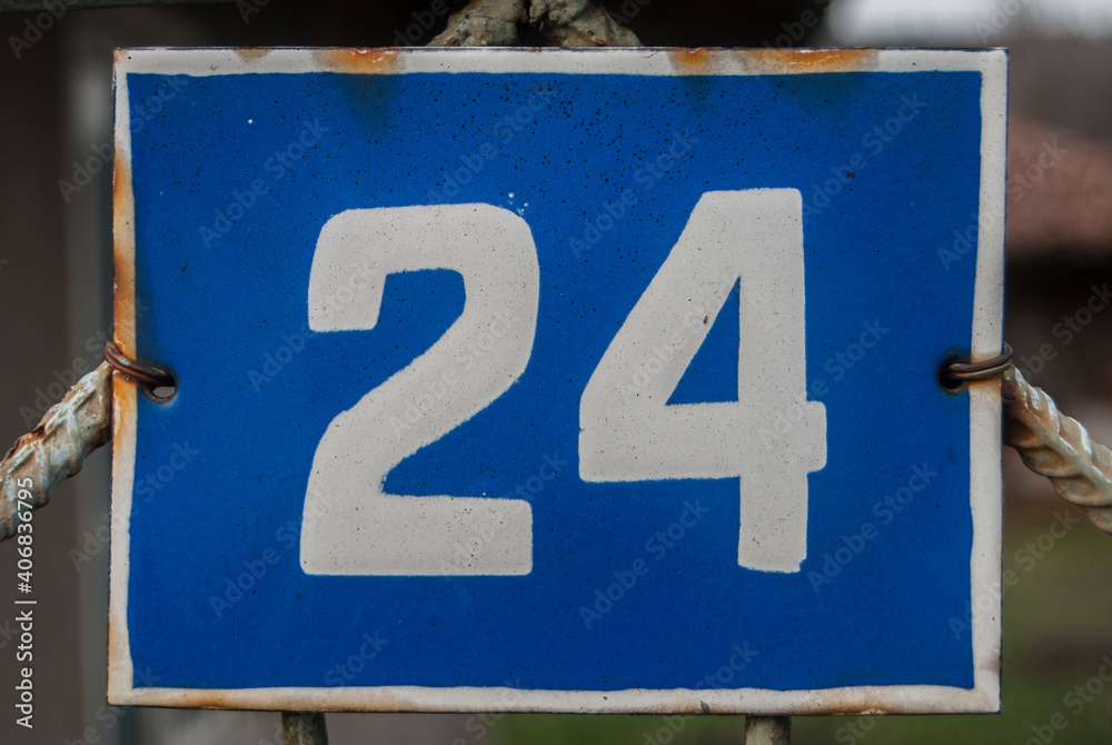 Weathered grunge square metal enameled plate of number of street address with number 24 Weathered grunge square metal enameled plate of number of street address with number 24