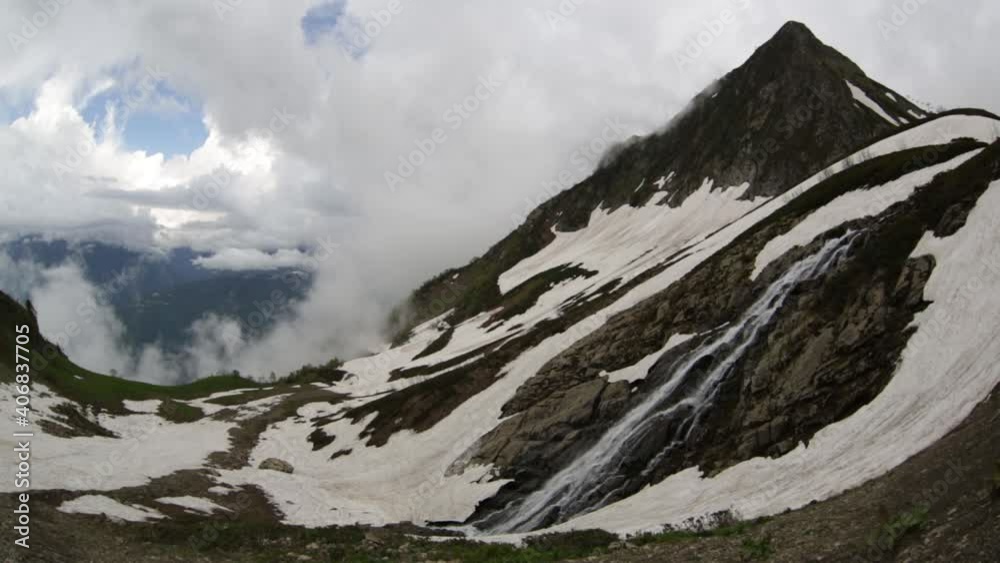 Beautiful landscape with a waterfall in the mountains of the Central Caucasus
