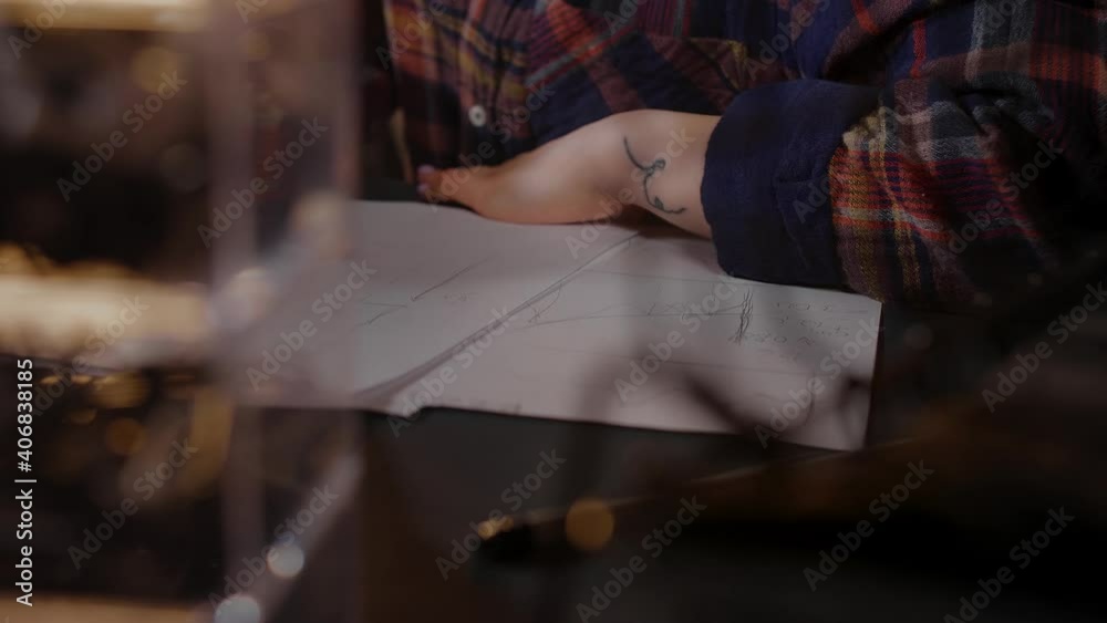 Close-up of the girl's hands. The girl is a freelancer writes something at home Close-up of the girl's hands. The girl is a freelancer writes something at home