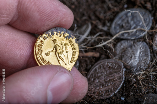 A treasure of Roman gold and silver coins.Trajan Decius. AD 249-251. AV Aureus.Ancient coin of the Roman Empire.Authentic  silver denarius, antoninianus,aureus of ancient Rome.Antikvariat. photo