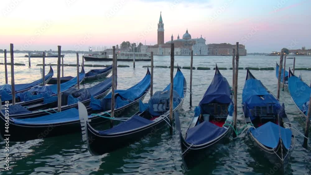 Gondolas are moored at the pier near Piazza San Marco in Venice, iopposite the church of Cathedral of San Giorgio di Maggiore
Gondolas are moored at the pier near Piazza San Marco in Venice, iopposite the church of Cathedral of San Giorgio di Maggiore