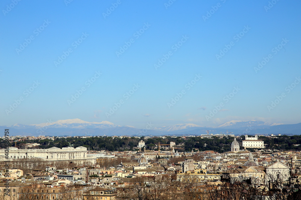 Aerial view of the city of Rome with snow capped mountains, Italy Aerial view of the city of Rome with snow capped mountains, Italy