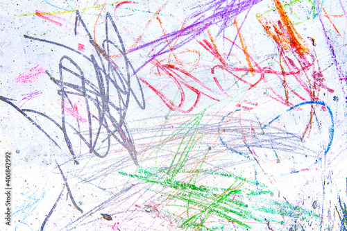 Children s chaotic drawings in colorful chalk on a white blackboard. Abstract pattern texture background