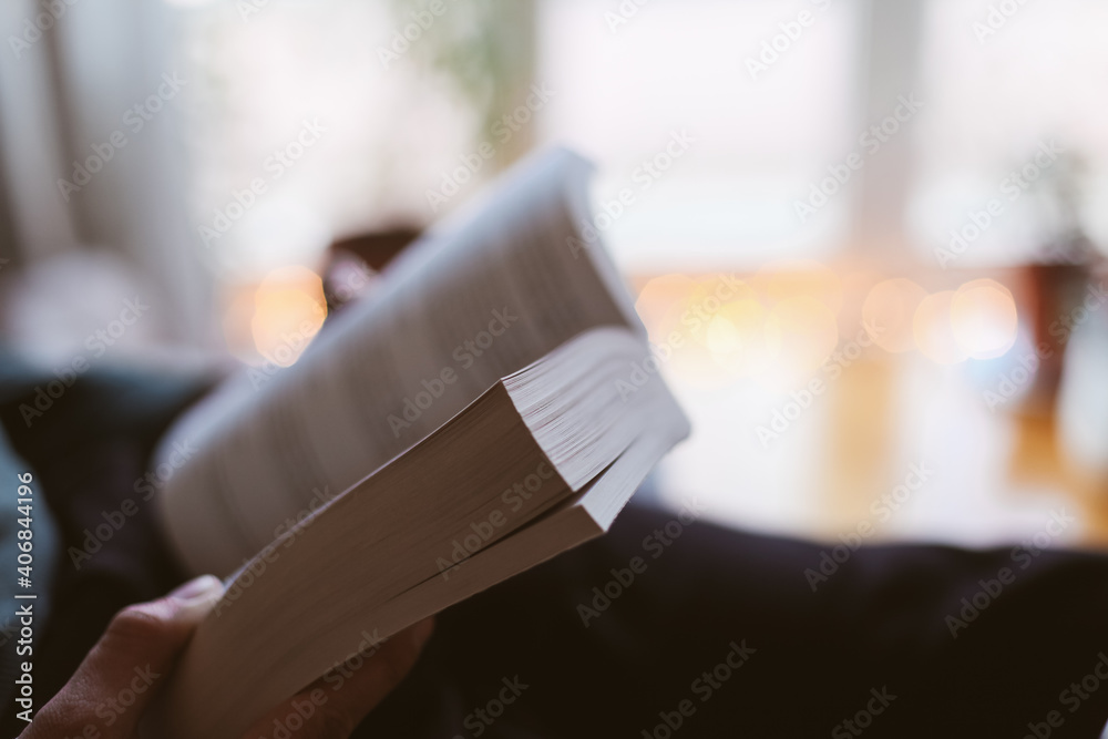 A close up picture of a book, with cosy atmosphere 