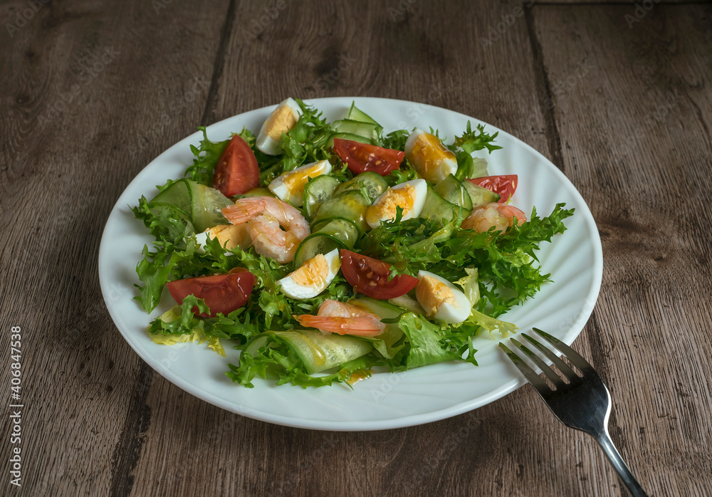 Green salad with shrimps, quail eggs, cucumber and tomato. Healthy breakfast with herbs, shrimps and eggs Green salad with shrimps, quail eggs, cucumber and tomato. Healthy breakfast with herbs, shrimps and eggs