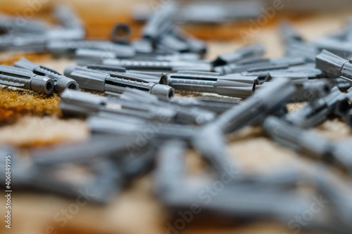 Scattered gray dowels on the carpet.