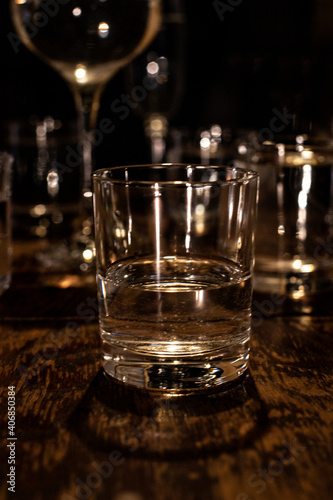 on a wooden background a glass with a drink
