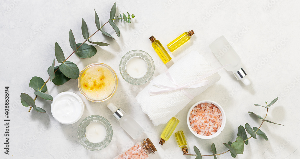Spa and wellness concept. Set of natural organic cosmetic products on white marble background top view. Skin care cosmetic. Spa and wellness concept. Set of natural organic cosmetic products on white marble background top view. Skin care cosmetic.