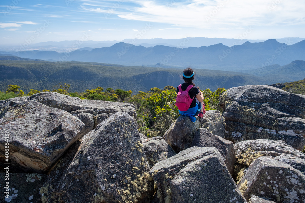 Woman admiring beatufiul mountains view in Grampians, Victoria, Australia