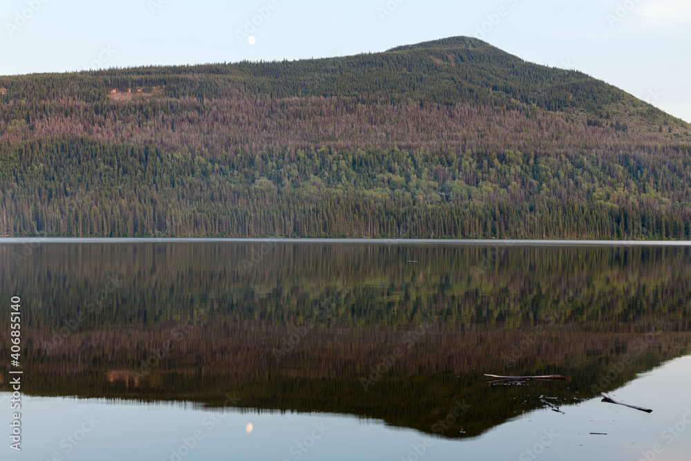 Wooded hills across the lake at Gwillim Lake Provincial Park, British Columbia, Canada