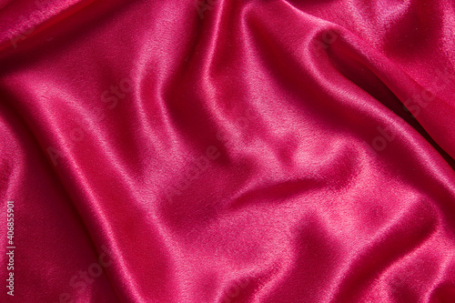 Red crepe satin fabric with folds - abstract background
