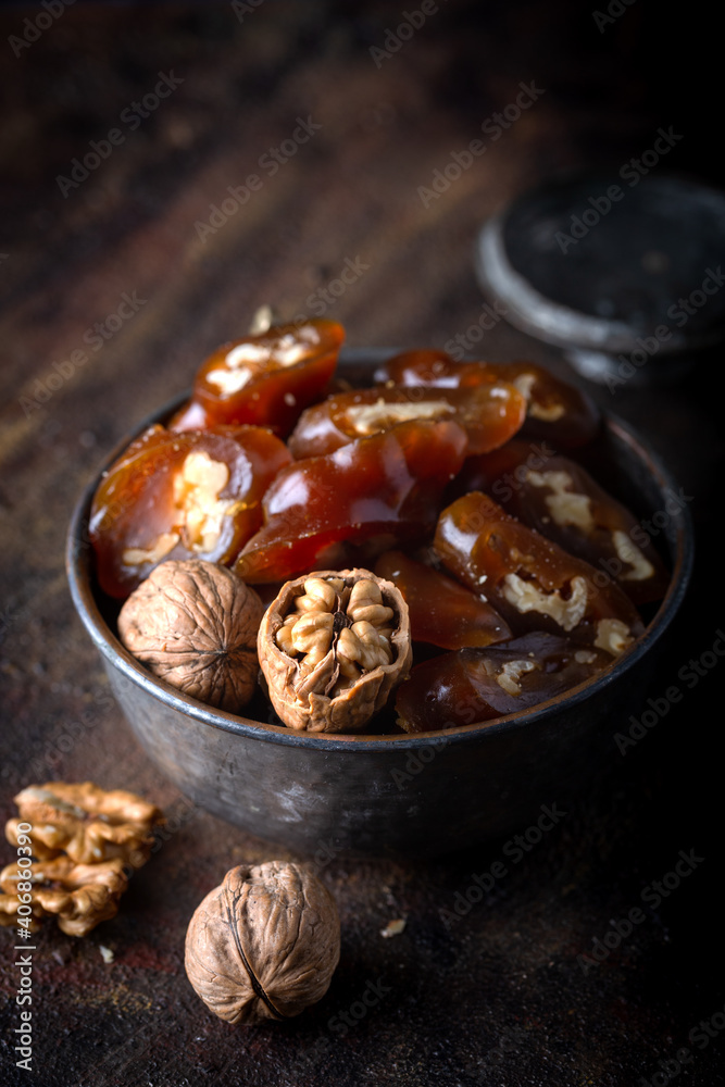 Churchkhela Pestil or Walnut Fruit Pulp in bowl on dark background. Churchkhela Pestil or Walnut Fruit Pulp in bowl on dark background.