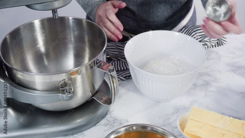 Step by step. Mixing ingredients in standing electric mixer for baking peanut butter cookies.