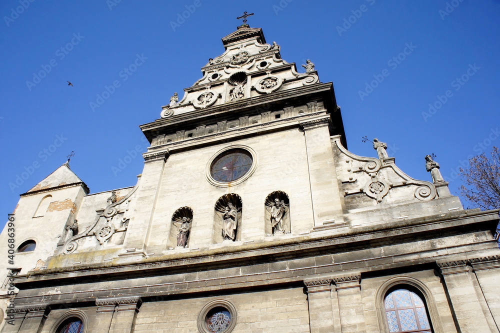 old Catholic Church. the upper part of the facade of the Catholic church. medieval architecture. sculptural elements on the facade of the church
