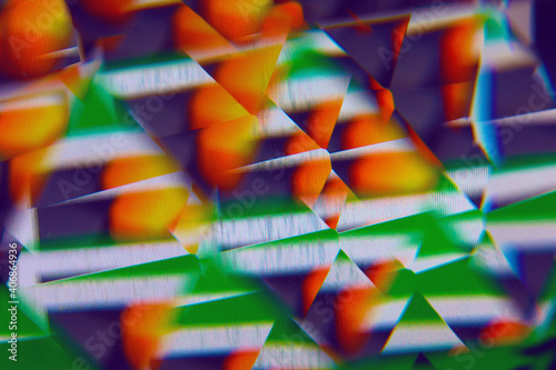 Faceted prism macro abstract background of color images on a computer monitor