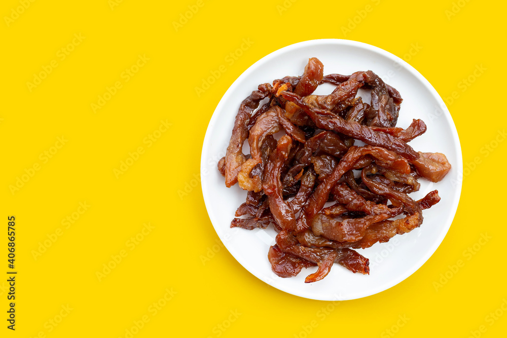 Deep fried sun-dried pork on yellow background. Deep fried sun-dried pork on yellow background.
