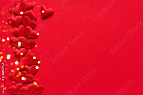 Valentines Day concept. Red hearts on a red background. Top view, copy space © Laima Gri