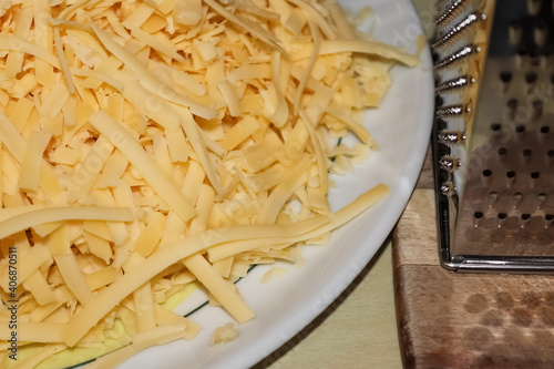 Close up of fresh chopped cheese as topping for a pizza. photo