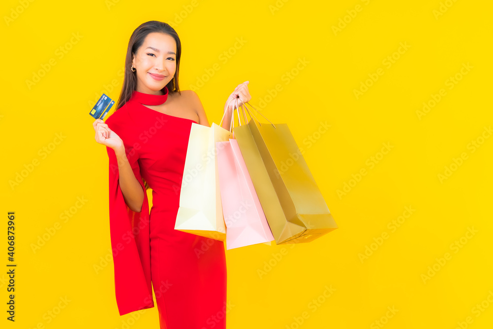 Portrait beautiful young asian woman with shopping bag and credit card Portrait beautiful young asian woman with shopping bag and credit card