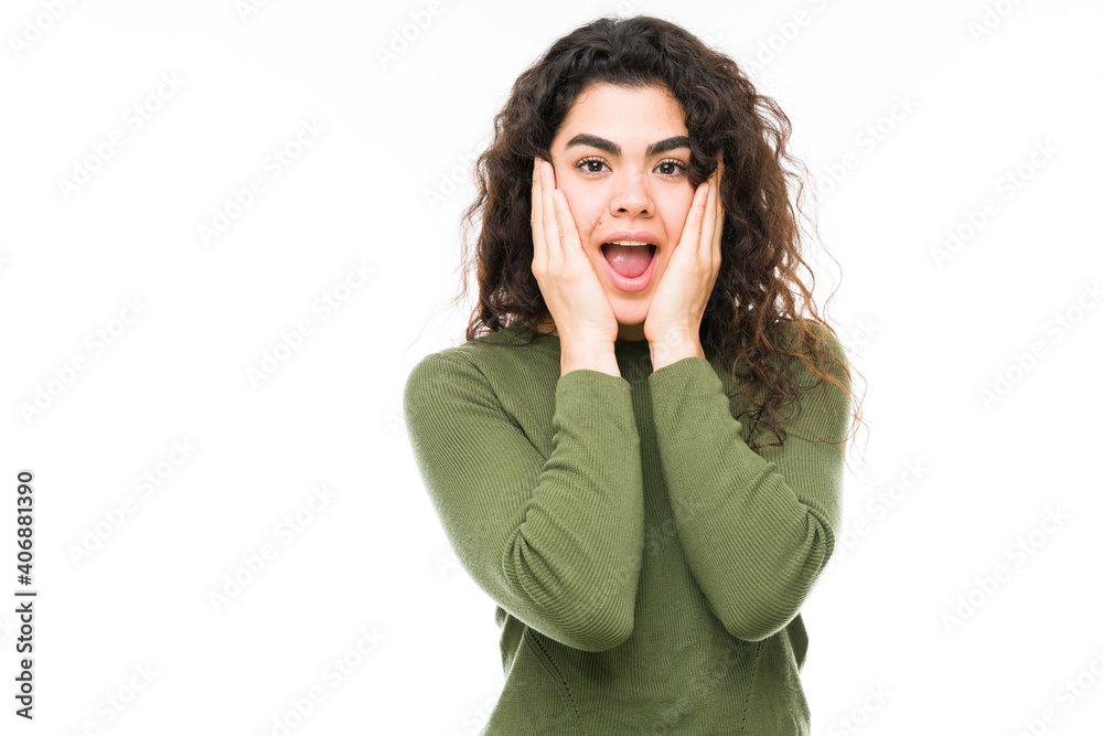 Portrait of an woman looking surprised and shocked Portrait of an woman looking surprised and shocked