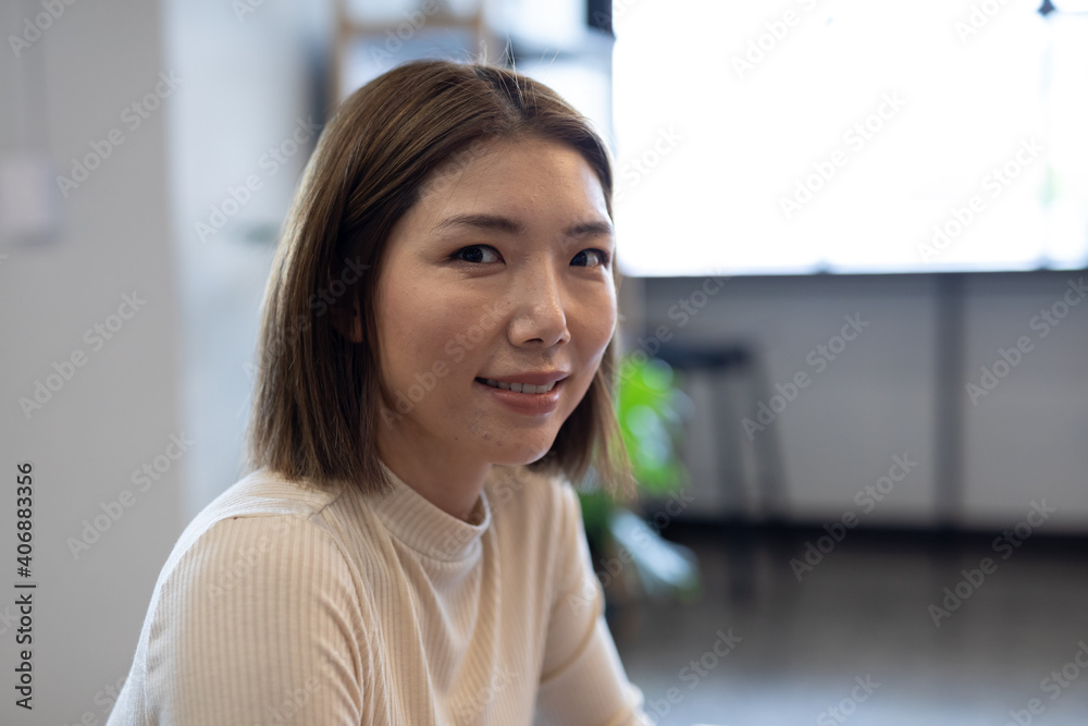 Asian businesswoman working in creative office