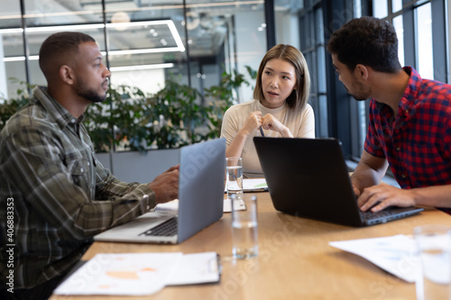 Diverse group of business people working in creative office