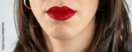 Close-up lips of young beautiful woman. Sexy red lips. Lip Makeup. Glossy red lipstick. Panoramic shot. Close-up macro shot. High quality image. Panorama banner.