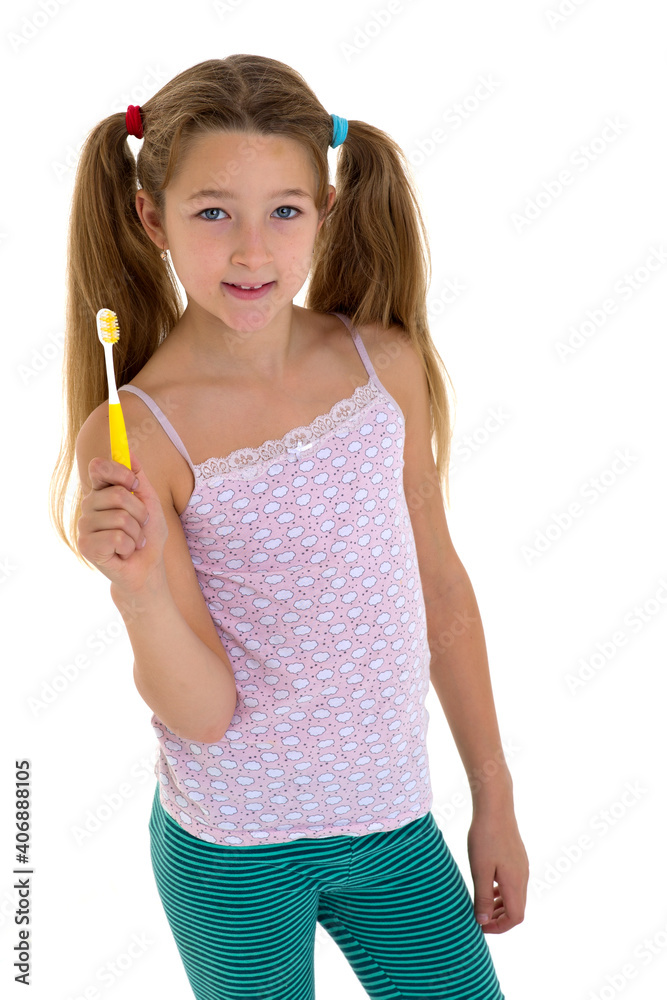 Smiling girl standing with toothbrush Smiling girl standing with toothbrush