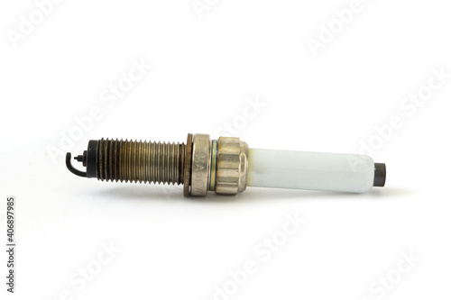 Black oily deposits on the electrodes and insulator tip points to an oil-fouled plug on spark plug with copy space on white background.