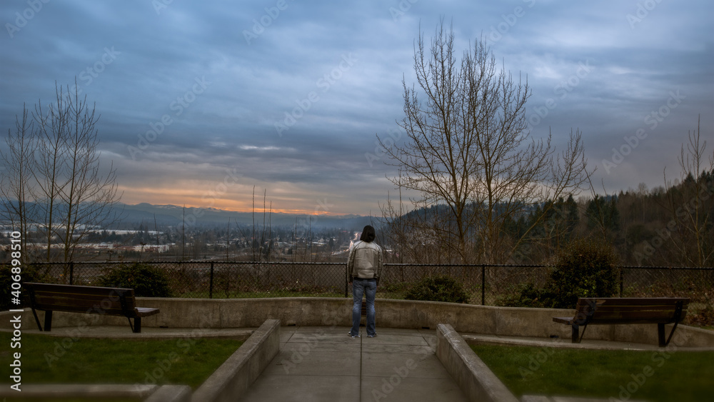 jogging in the park in spring standing overlooking mountain freeway urban park moody jogging in the park in spring standing overlooking mountain freeway urban park moody