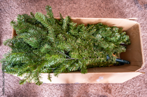 Boxed artificial Christmas tree before or after seasonal setup for holidays