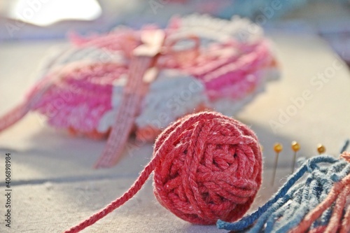 Pink cotton rope for knitting macrame in role on the pad