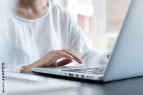 Business woman working on laptop from home office