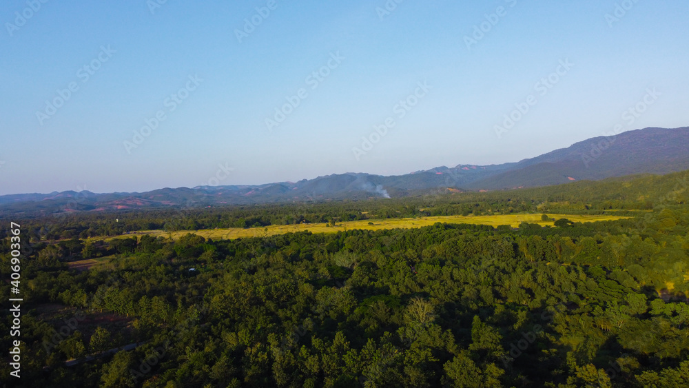 Aerial view of mountains with green forest.