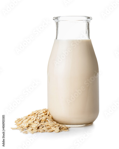 Bottle of oat milk on white background photo