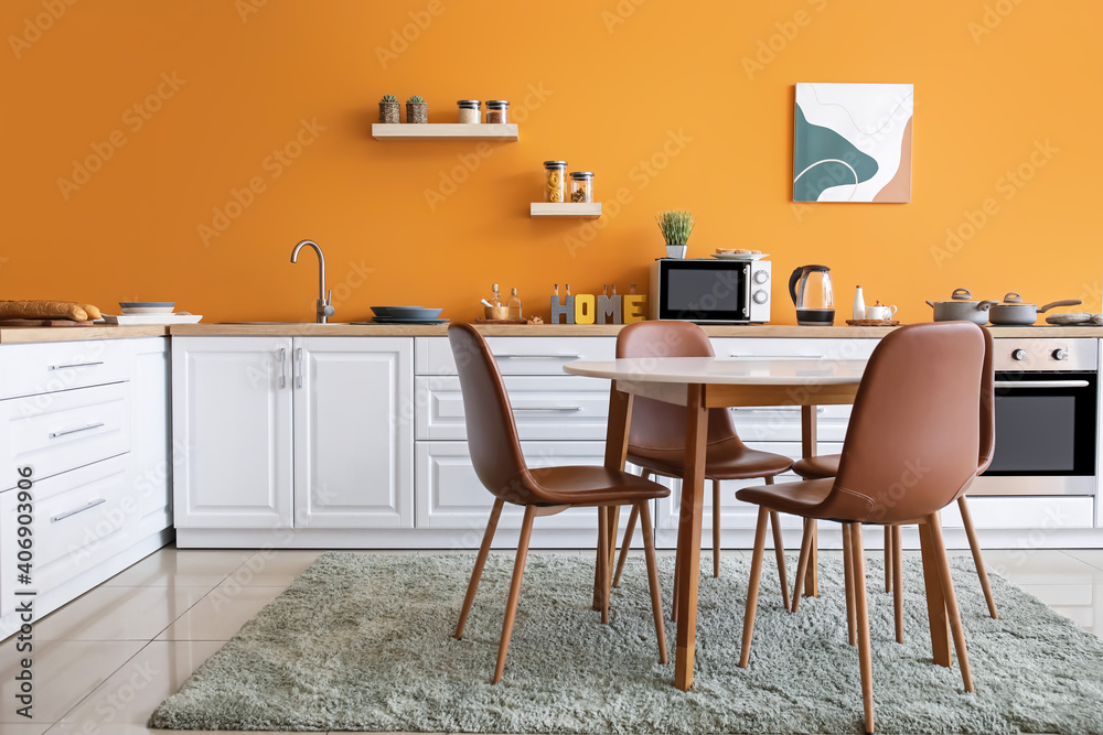 Interior of modern kitchen with dining table