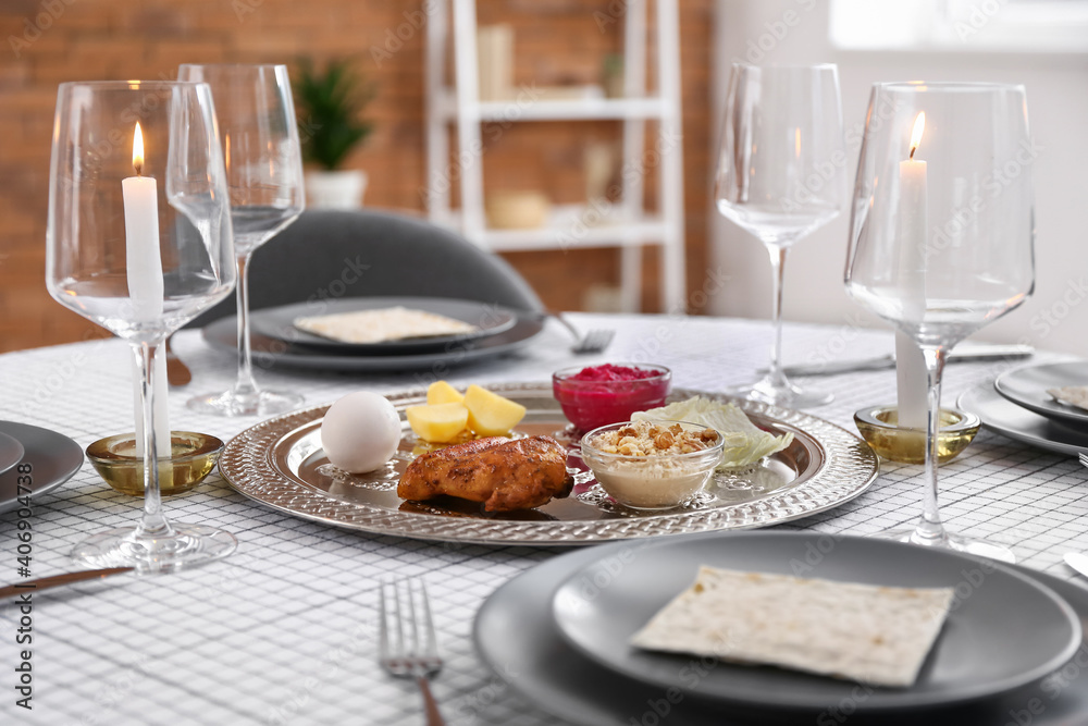 Passover Seder plate with traditional food on served table Passover Seder plate with traditional food on served table