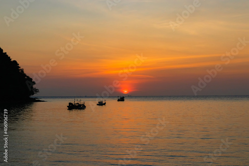 Beautiful sunset above the sea and mountain.