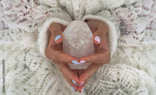 Woman's hands holding the natural protection crystal.