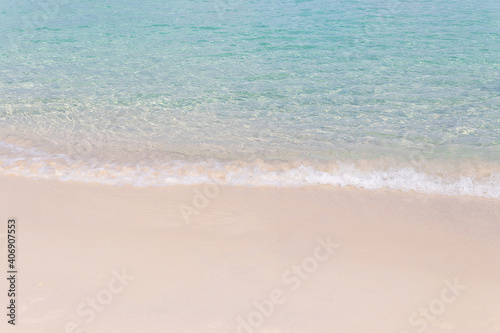 Beautiful ocean wave on sandy beach for Background. © Chalearmrat