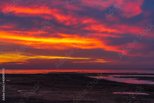 Beautiful fiery dawn on sea