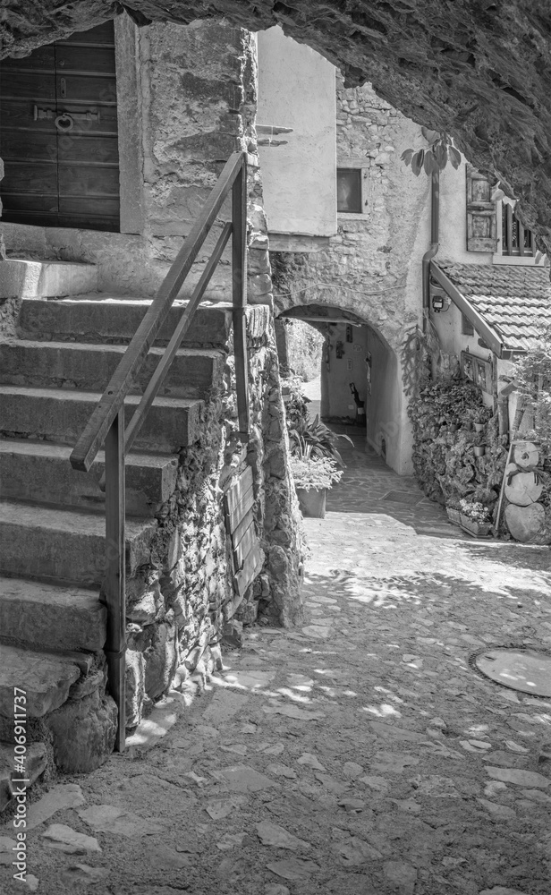 CANALE DI TENNO, ITALY - JUNE 9, 2019: The ailsle in the little rural mountain village near Lago di Teno lake.