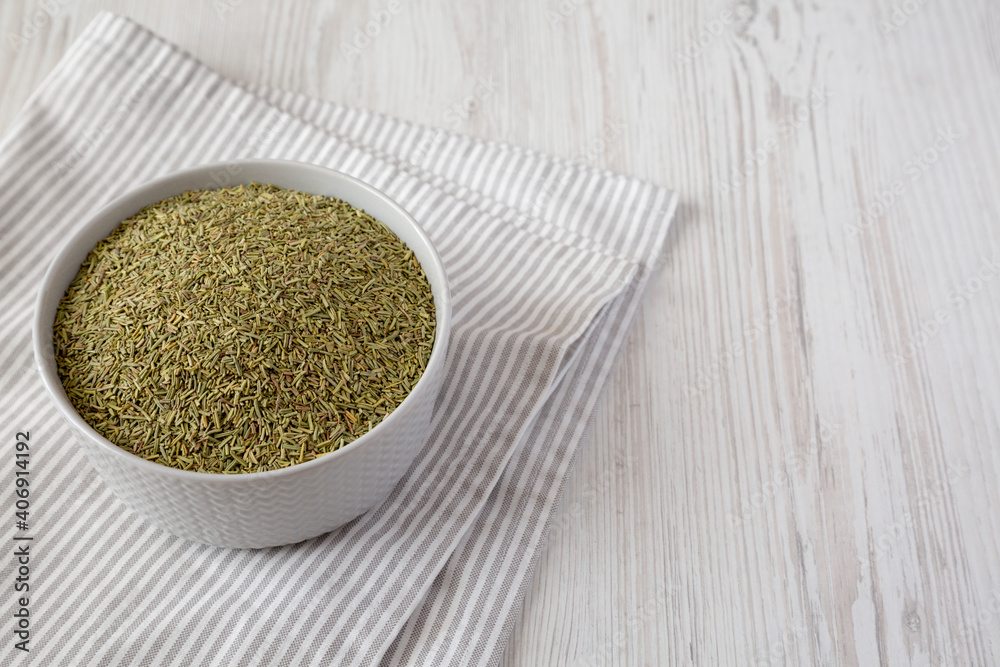 Organic Dried Rosemary in a Bowl, low angle view. Copy space. Organic Dried Rosemary in a Bowl, low angle view. Copy space.
