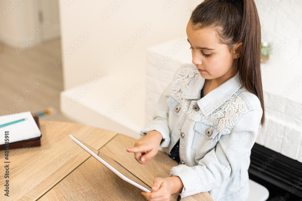 people, children and education concept - girl with tablet pc computer writing at home people, children and education concept - girl with tablet pc computer writing at home